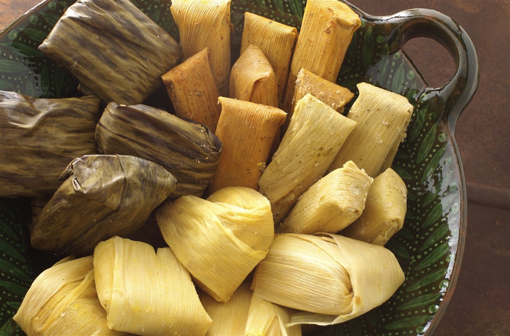 Tamales: corn dough filled with meat of vegetables, boiled inside corn husks