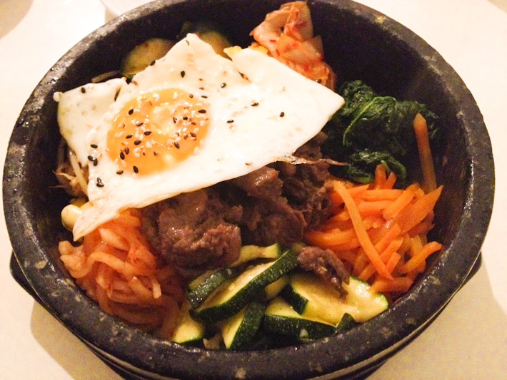 비빔밥 Bibimbap: a popular Korean dish with rice, vegetables, meats and fried egg. A bowl of delicious comfort food!
