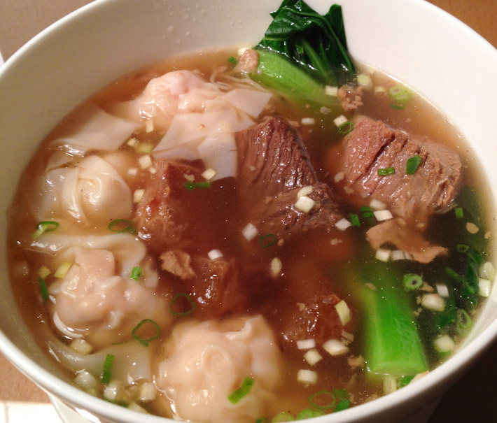 Beef stoup with prawn dumplings and pak choi