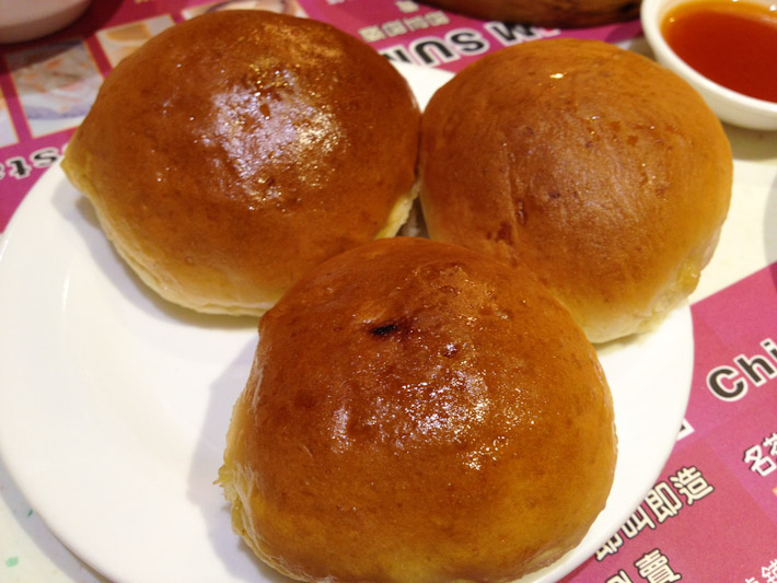 Baked pork buns: sweet dough with a filling of caramelized pork and onions.