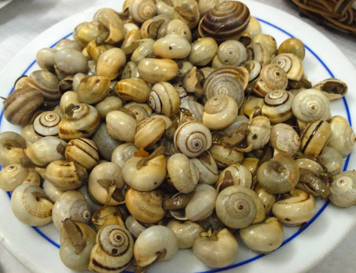 Caracois: buttery snails cooked with butter and herbs. In Lisbon!