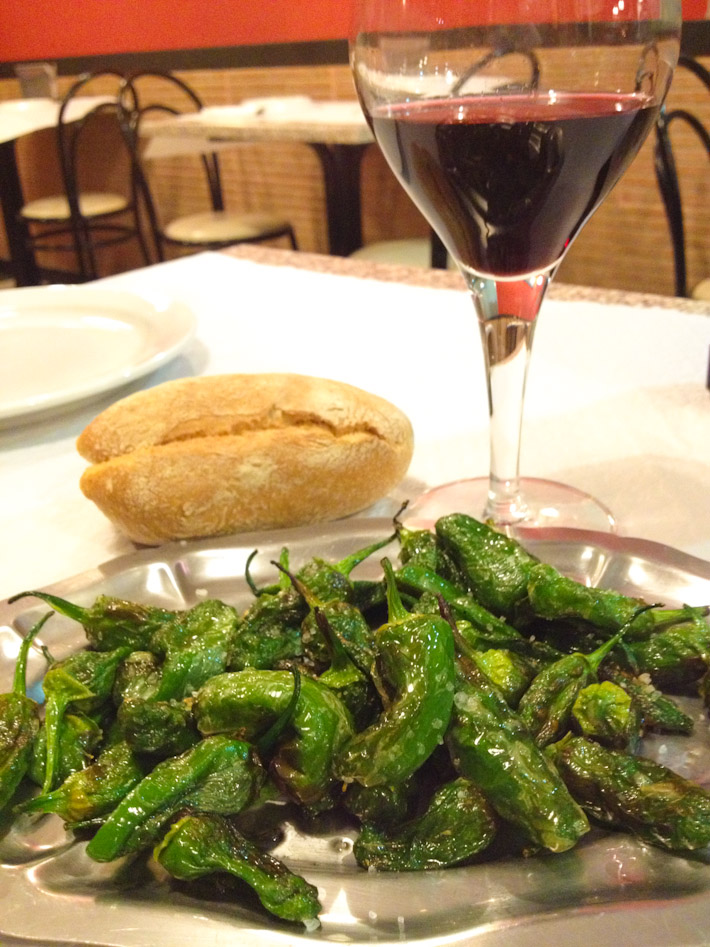 Pimientos de Padron: slightly fried and salted. Best with country-side style bread and red wine from Galicia!