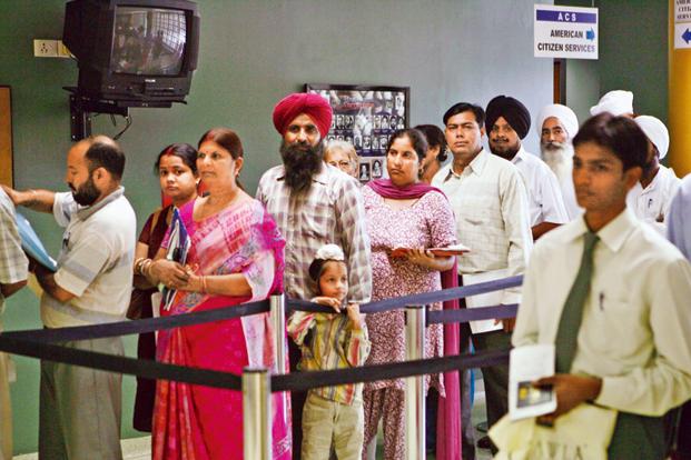 People waiting for visa at the consular section of the US embassy, in New Delhi. Photo: AP