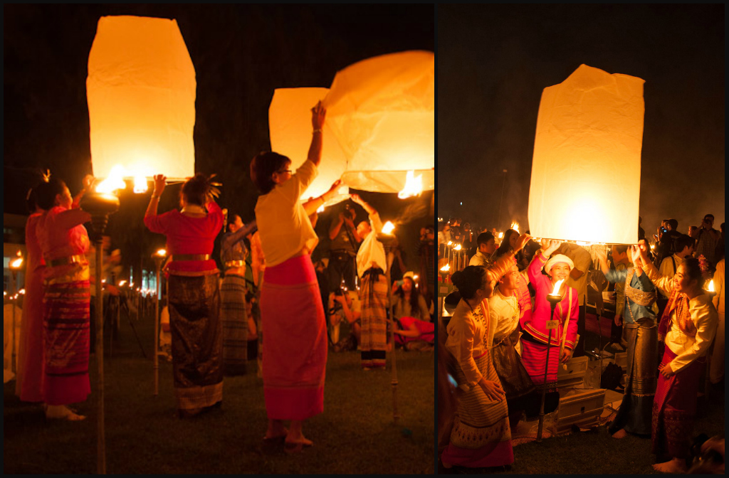 A group of friends with traditional Lanna clothes prepare to release their lanterns into the sky
