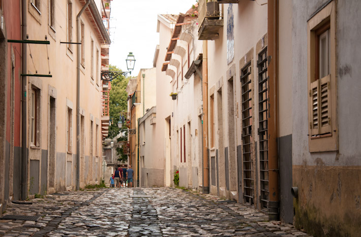 The streets of traditional areas of Lisbon are covered in cobblestone