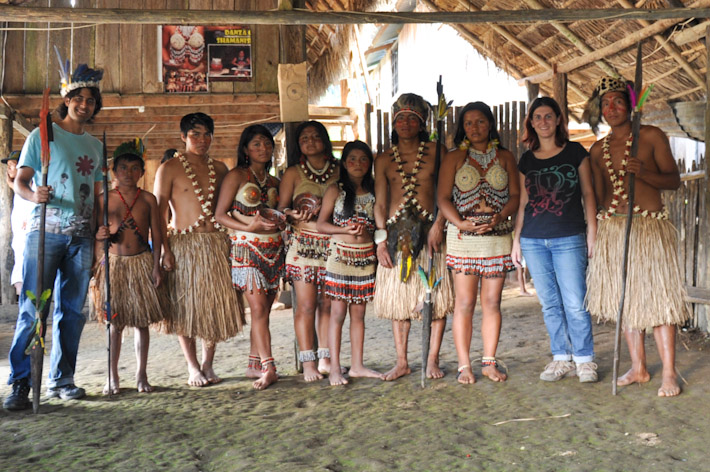 Posing with a local group of dancers in the Amazon Jungle, Ecuador. A rather touristic experience but we got to see where they live, what they eat, etc..