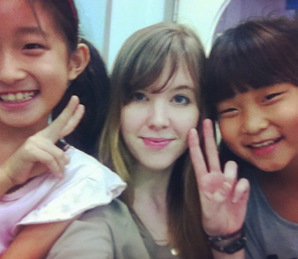Marie taking a selfie during class with her students in South Korea
