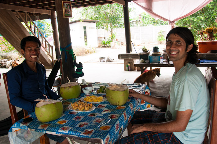 Eating with a local student in Cambodia - 'cause fresh coconut tastes better with great company and tales of local life!