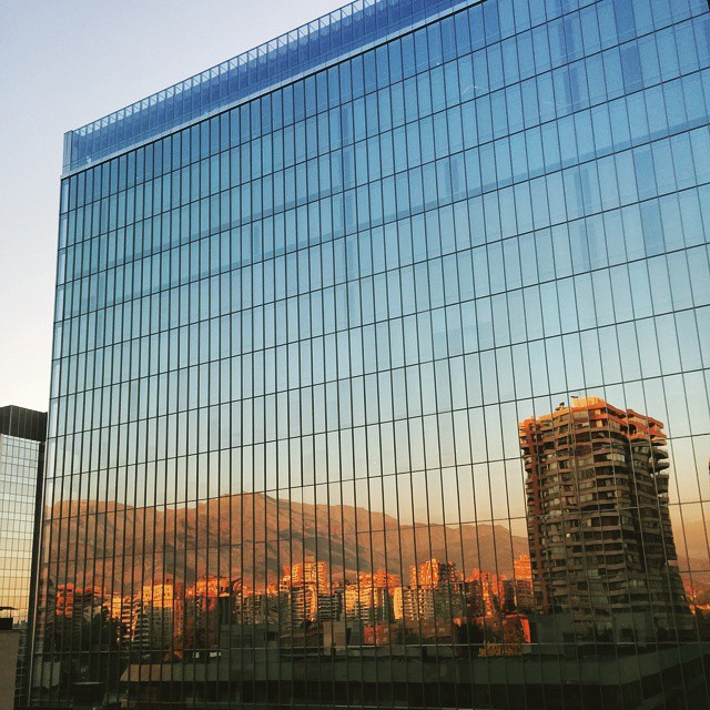The Andes mountains reflected on a glass building in Santiago de Chile