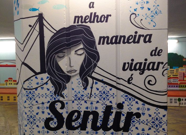 "The best way to travel is to feel", mural in Lisbon