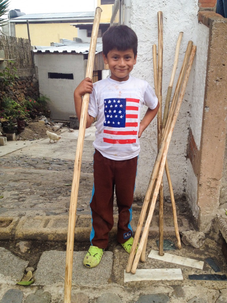Kids sell walking sticks for 5 Quetzales to Pacaya visitors