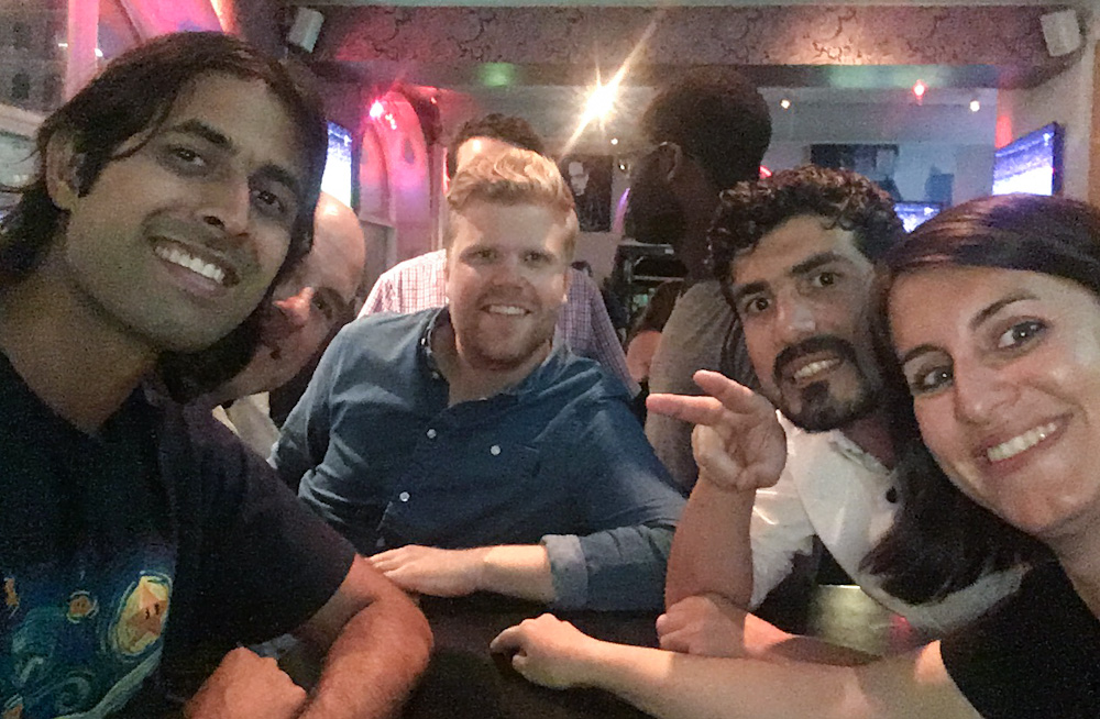 A multicultural night out in Stockholm: an Indian, an US American, an Iraqui, a Portuguese and a few Swedes, celebrate Portugal's victory in the European football championship