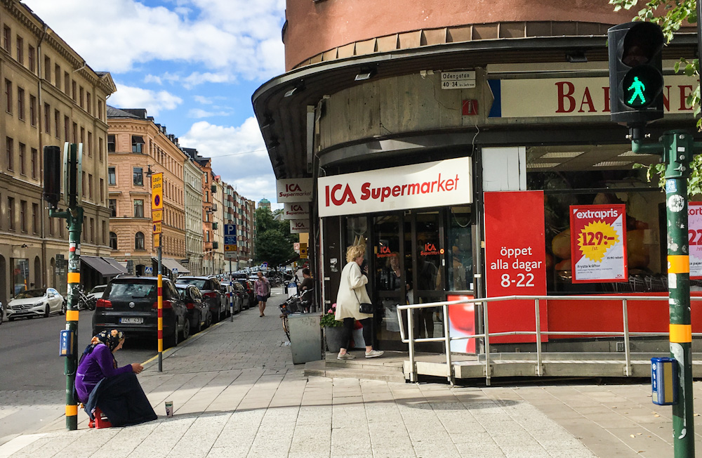 Begging by the supermarket in Stockholm