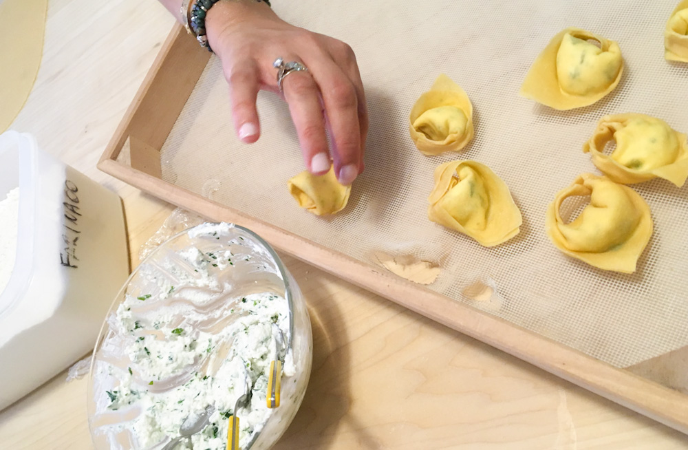 Stuffing tortelloni with a mix of ricotta and parsley typically used around Bologna