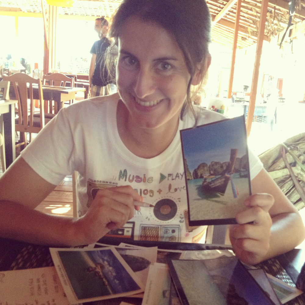 Writing postcards for Backpack ME readers in Thailand
