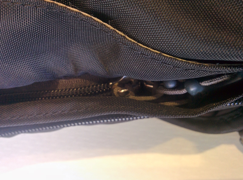 Step 3 - Tuck the zipper tags under the flap if your bag has once